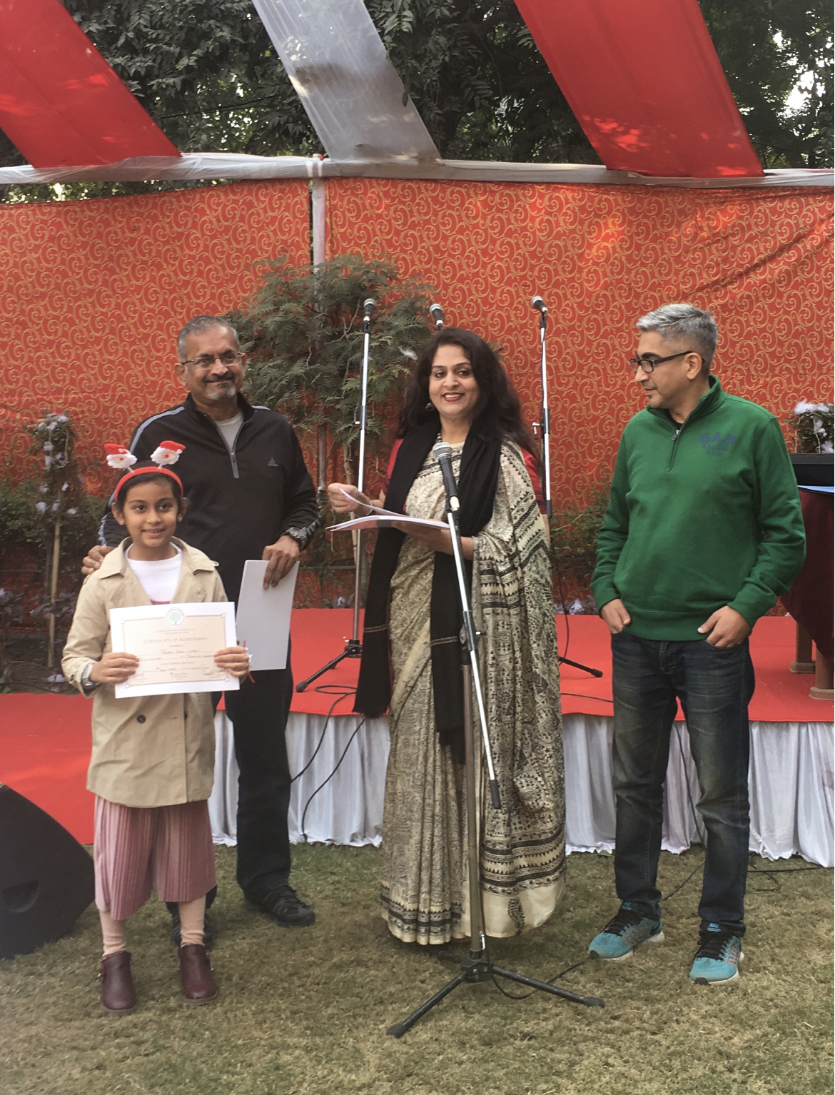 Priyal holding her Certificate of Achievement at the community Christmas talent show